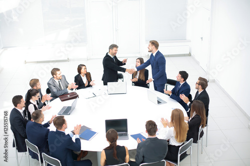 head of the company speaks to colleagues at conference