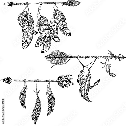 Arrow in ethnical pattern with feathers
