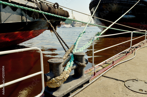 Ships moored to the pier.