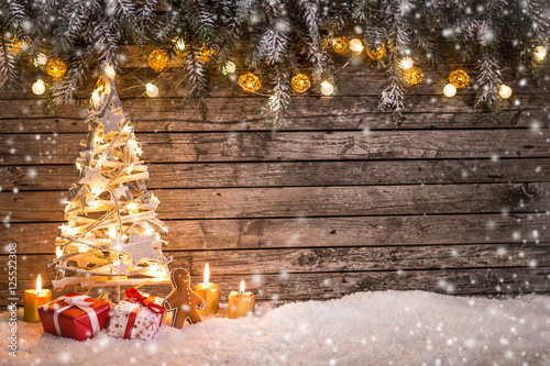 Christmas tree on wooden background