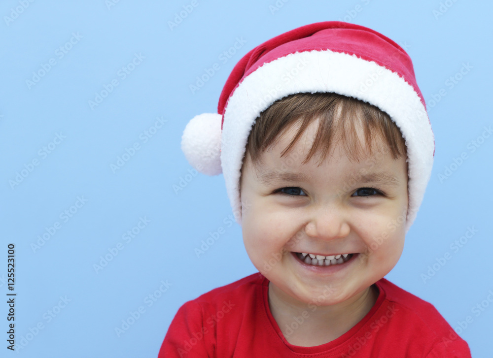 litlle kid dressed as santa claus laughing litlle kid dressed as santa claus laughing