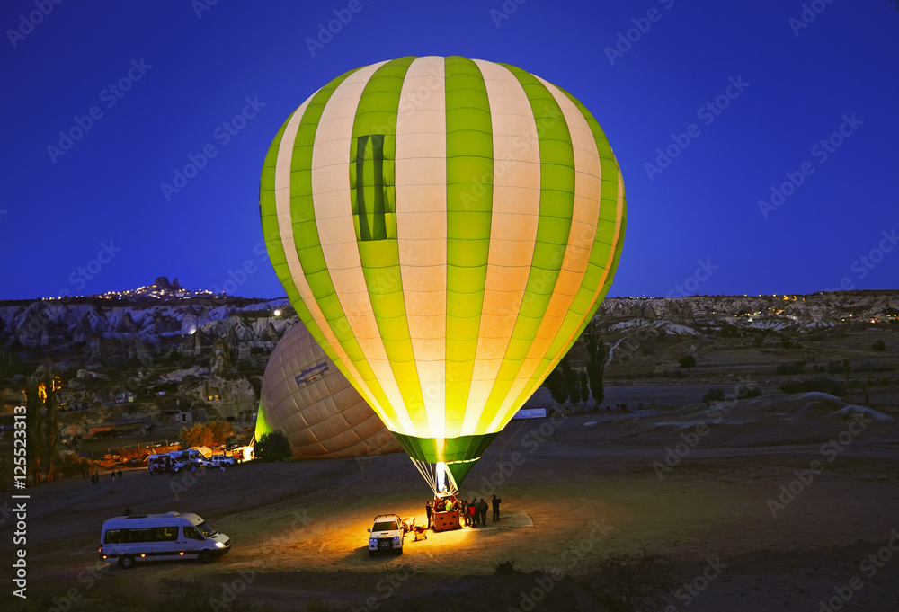 Colorful hot air balloon before launch   at Cappadocia, Turkey. Volcanic mountains in Goreme national park.