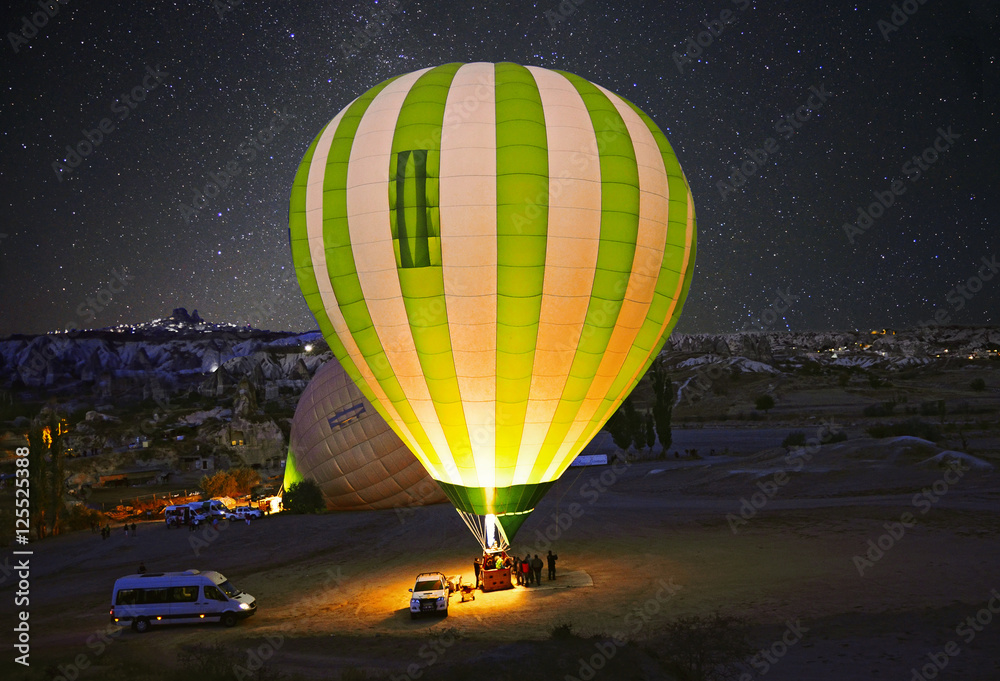 Obraz premium Colorful hot air balloon before launch at Cappadocia, Turkey. Volcanic mountains in Goreme national park