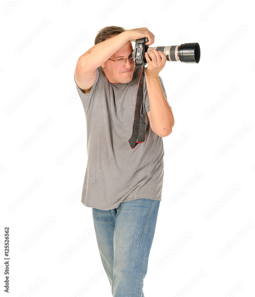 Middle age man portrait with dslr camera and big tele lens isolated on white Middle age man portrait with dslr camera and big tele lens isolated on white