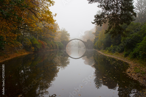 Rakotzbrücke (Devil's bridge) in early morning mist photo