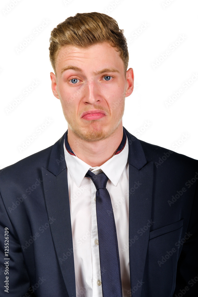 Disgusted young business man wearing suit isolated on white portrait Disgusted young business man wearing suit isolated on white portrait
