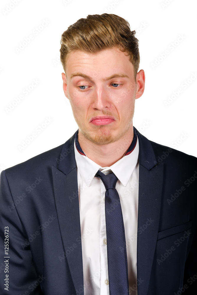 Disgusted young business man wearing suit isolated on white portrait Disgusted young business man wearing suit isolated on white portrait