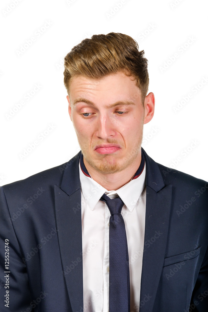 Disgusted young business man wearing suit isolated on white portrait Disgusted young business man wearing suit isolated on white portrait