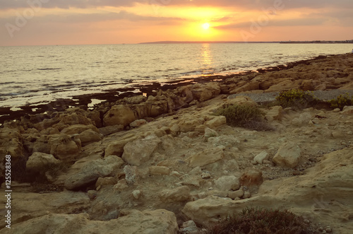 Sunset on the coral coast of the sea. Cyprus