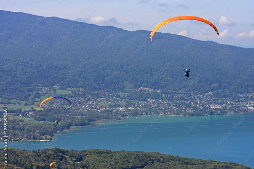 Paragliders above Lake Annecy Paragliders above Lake Annecy
