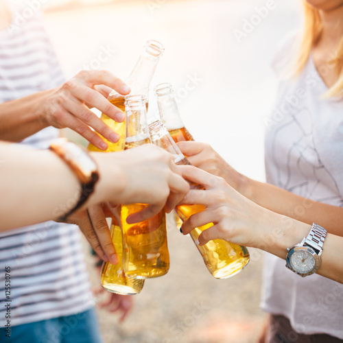 Friends cheering with beer