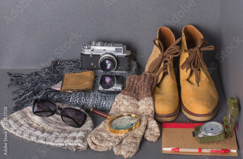 set of warm clothes for travel, camera