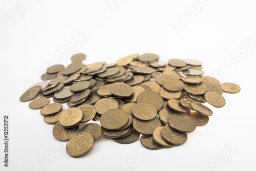 A bunch of Yellow coins on a white background