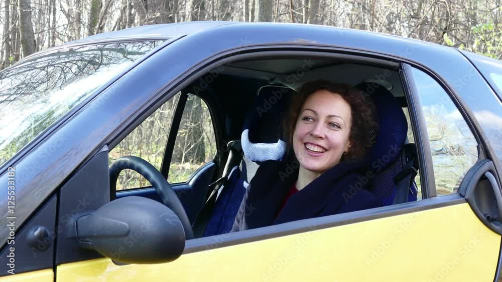 Cute happy lady driving car Cute happy lady driving car