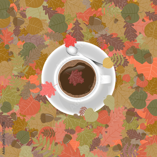 Cup of coffee in fall foliage.