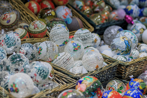 Colorful close up details of christmas fair market. Balls decora © Adamsov studio