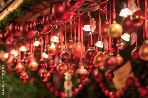 Colorful close up details of christmas fair market. Balls decorations for sales.