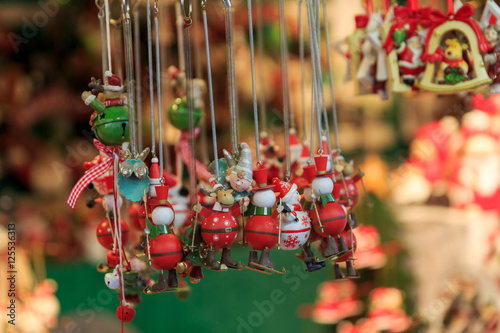 Colorful close up details of christmas fair market. Snowman and deer balls decorations for sales.