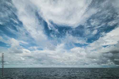 Open ocean and cloudy sky