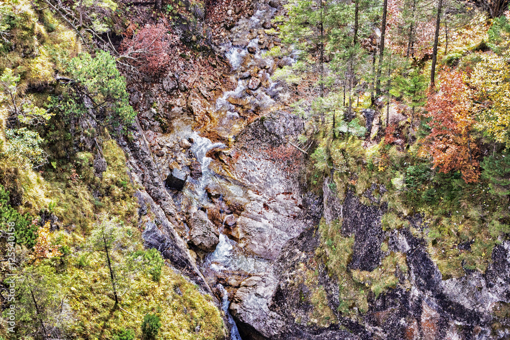 Aerial view of a gorge with a water stream