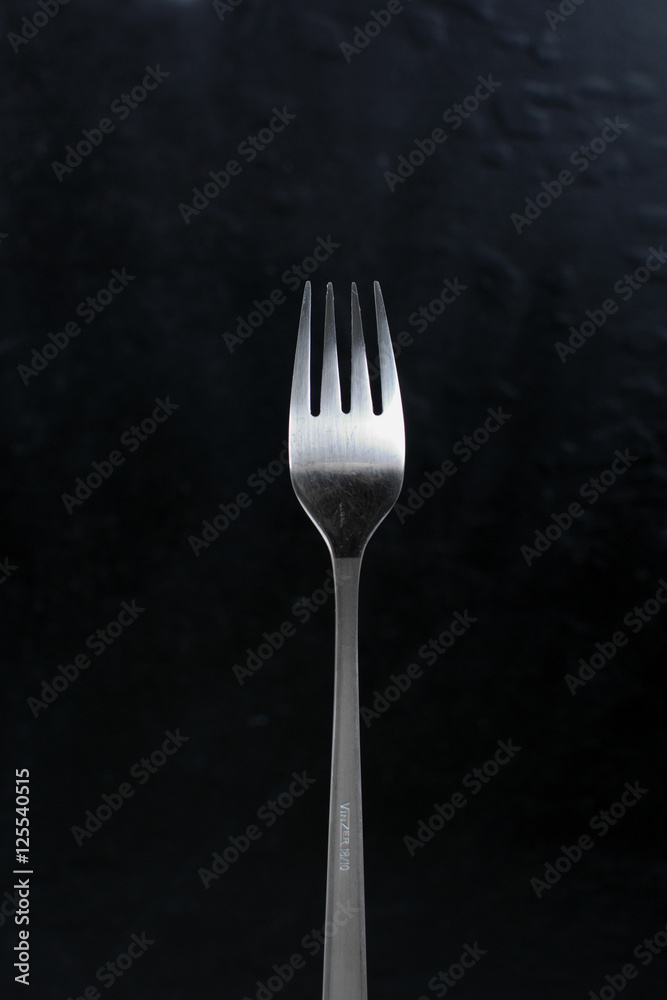 Fork for food. Isolated cutlery. Metallic fork with matte handle. Background. Fork for food. Isolated cutlery. Metallic fork with matte handle. Background.