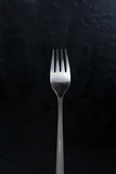 Fork for food. Isolated cutlery. Metallic fork with matte handle. Background.