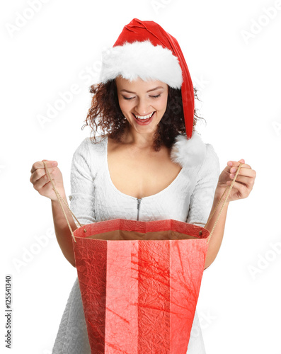 Happy woman opening Christm...