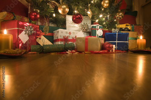 Christmas presents under an illuminated Christmas Tree