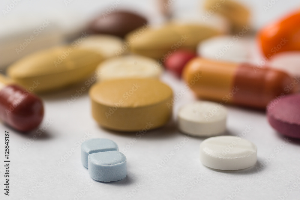 Multiple pills depicting medical treatment or pahrmaceutical ind Multiple pills depicting medical treatment or pahrmaceutical ind