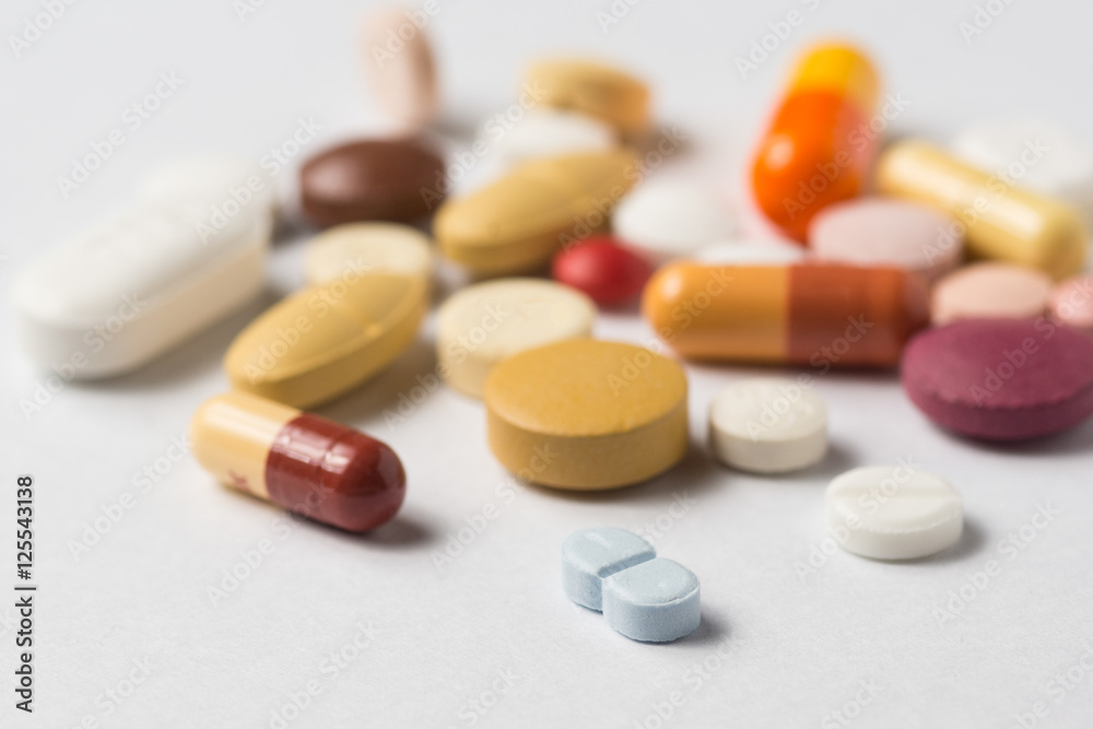 Multiple pills depicting medical treatment or pahrmaceutical ind Multiple pills depicting medical treatment or pahrmaceutical ind