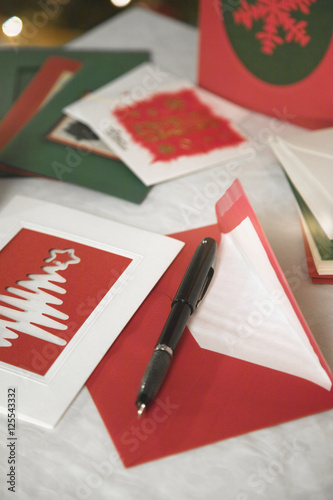 selection of home made Christmas cards on a table with envelopes