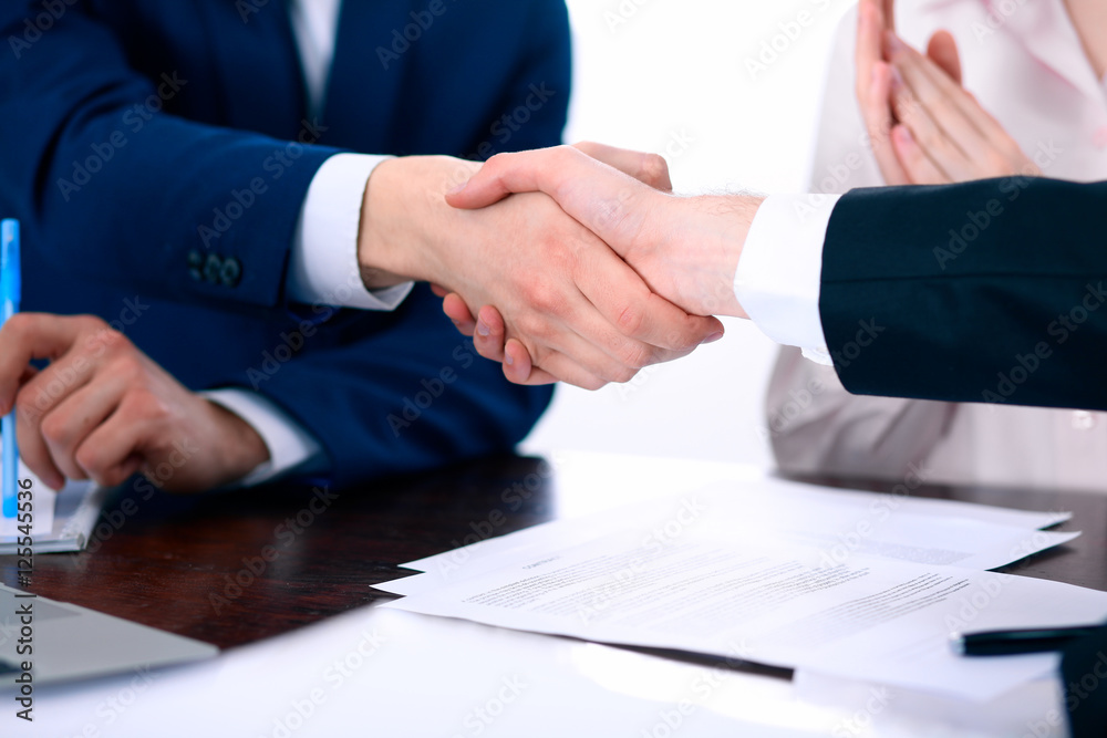 Business people shaking hands finishing up a meeting