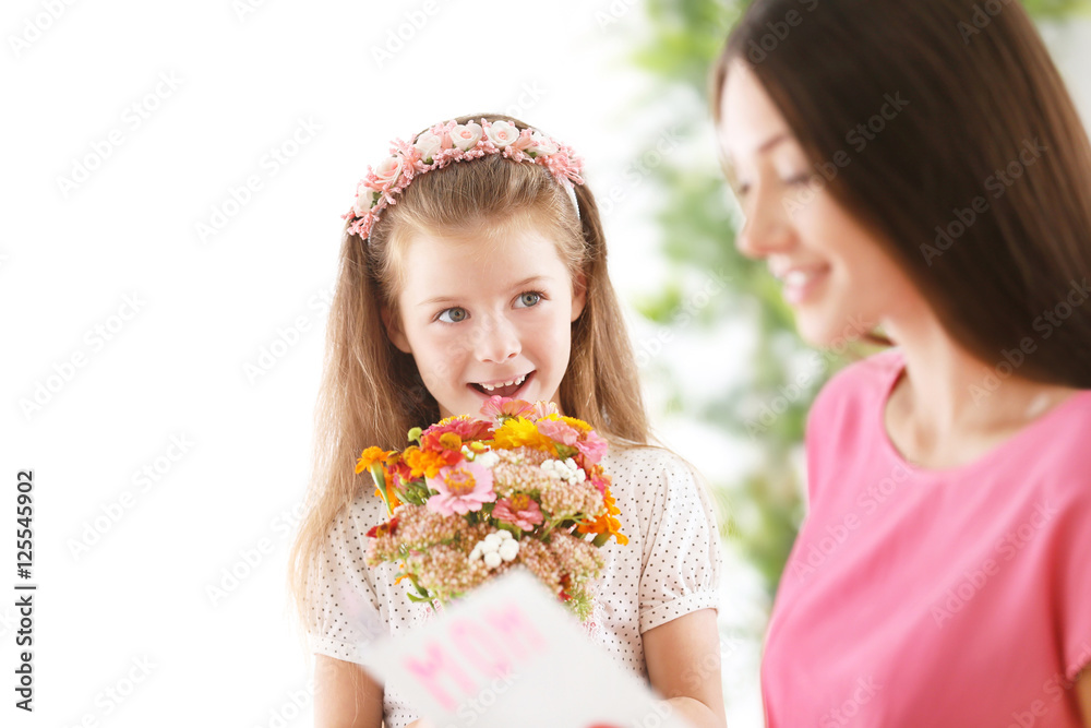 Greetings from daughter with flowers. Mothers day concept Greetings from daughter with flowers. Mothers day concept
