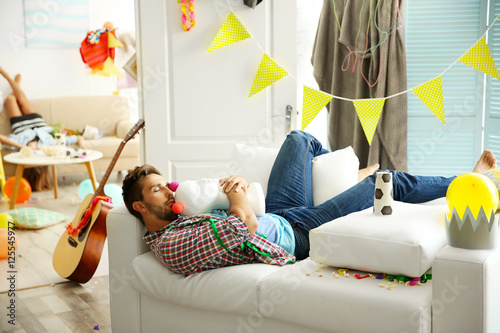 Canvas Print Tired drunk man after party at home