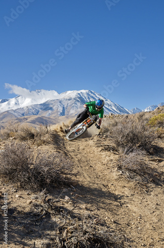 Mountain Biker Leans Into Turn