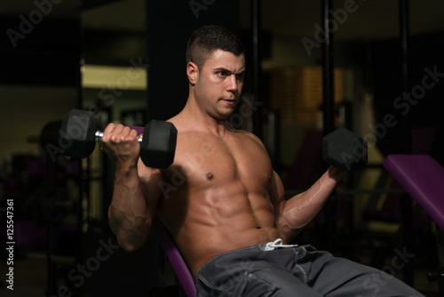 Biceps Exercise In A Gym