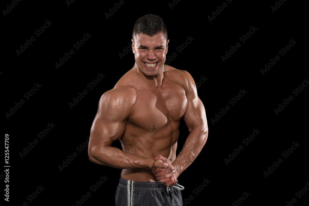Muscular Men Flexing Muscles On Black Background