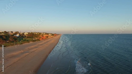 Flying above the beach Vale de Lobo. Tourist town of Portugal.