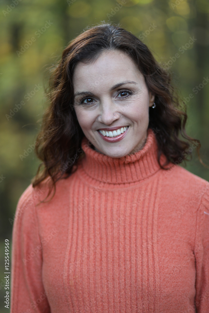 Woman with Brown Hair Against a Fall Background Woman with Brown Hair Against a Fall Background