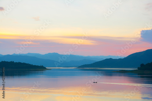 Colorful evening clouds above the dam and mountains from thailand,copy space.