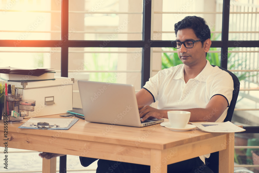 indian man working at office indian man working at office