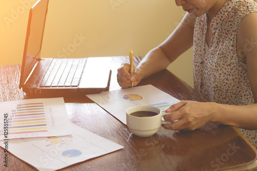 businesswoman working use laptop in office for discussing docume photo