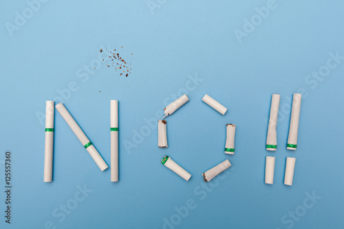no smoking concept  text made by cigarette on blue backgrounds