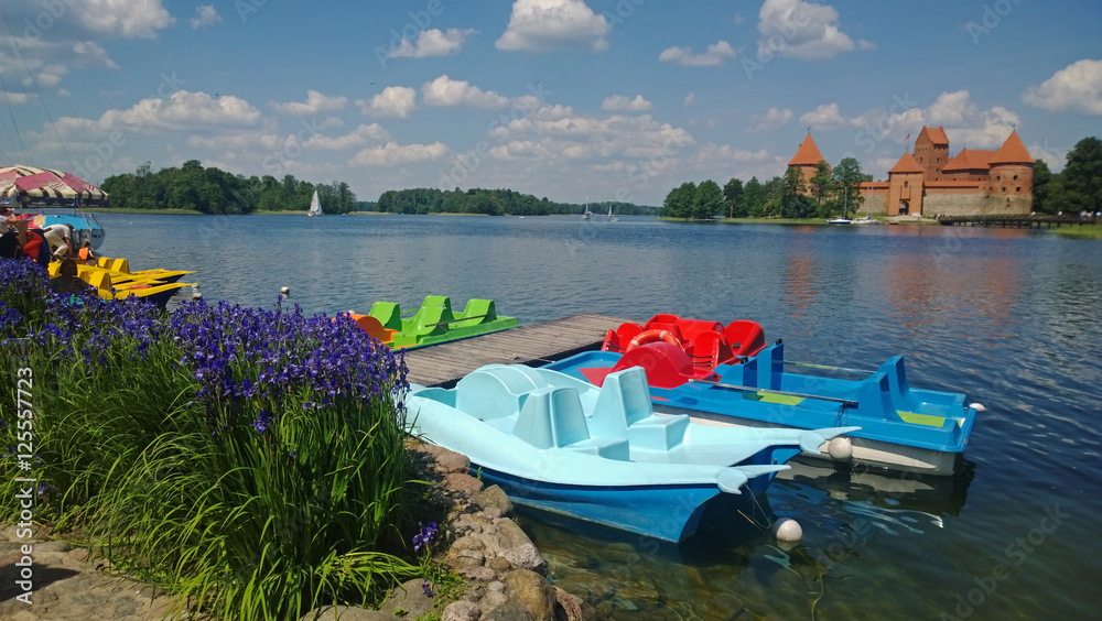 Catamarans are the backdrop of Trakai castle 