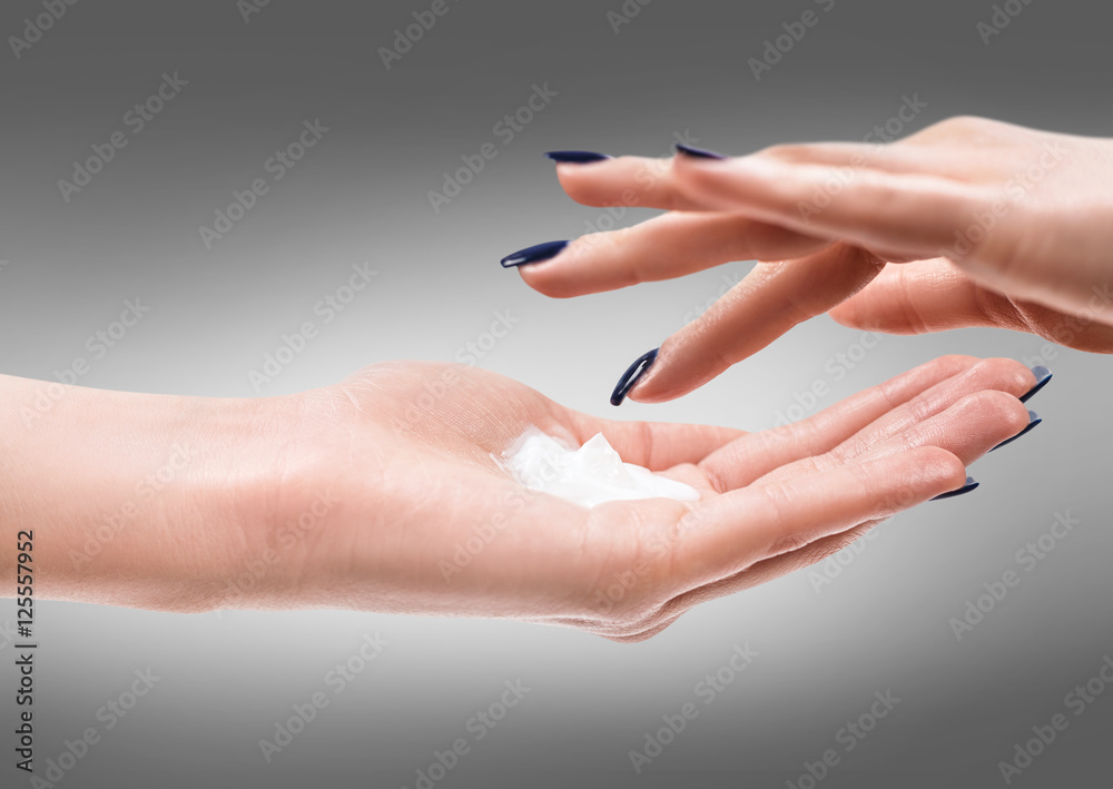 Beautiful female hands with cream