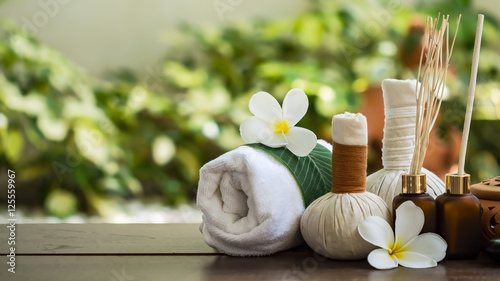 фотографія Spa massage compress balls, herbal ball on the wooden with treaments spa , Thail