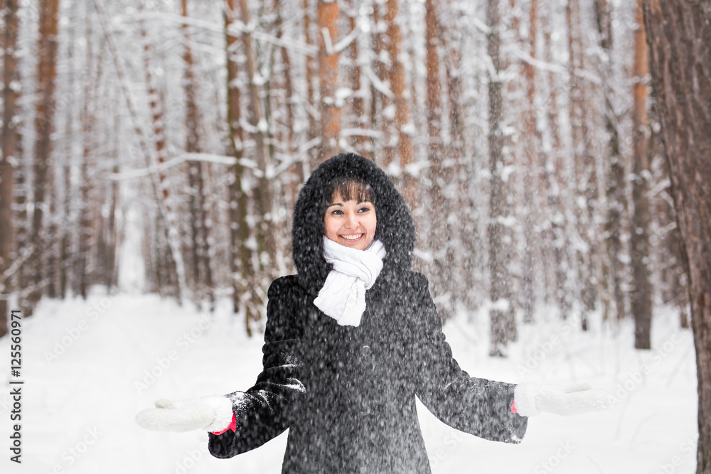 Happy young woman having fun in the snow Happy young woman having fun in the snow
