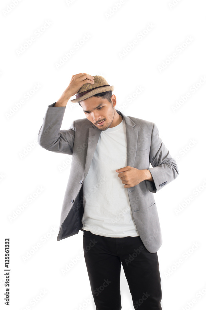 Portrait of young hipster man adjusting hat with head at camera Portrait of young hipster man adjusting hat with head at camera