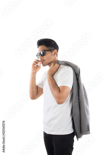 Young Business hipster man smoking a cigarette isolated on white