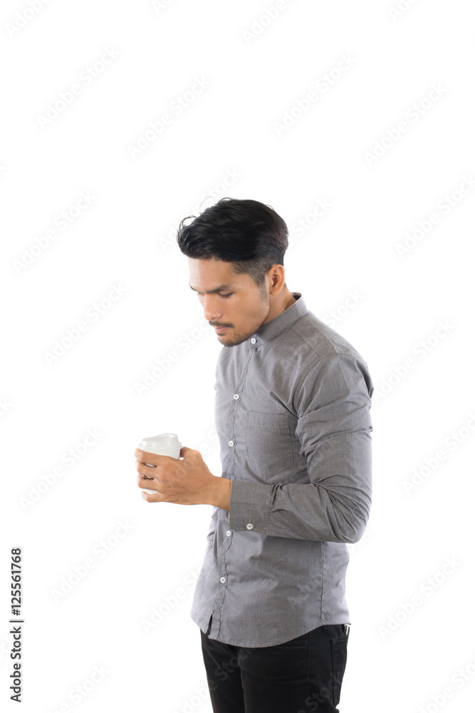 Handsome young hipster man holding coffee cup standing with isol Handsome young hipster man holding coffee cup standing with isol